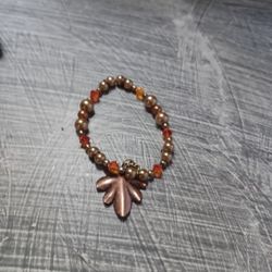 New Bracelet With Beads and Small Triangle Glass Orange With Georgeous Charm Leaf For Kids