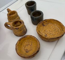 Clay mugs, cups, and bowls