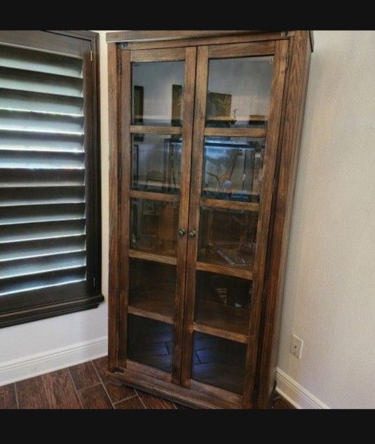 Solid Wood Curio Display Cabinet. Glass doors.  Ashley Furniture 