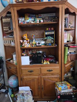 Solid oak entertainment center. Comes with five pieces.