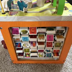 B. toys Zany Zoo Wooden Activity Cube.
