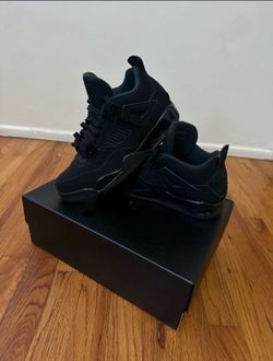 Black cat Jordan 4s