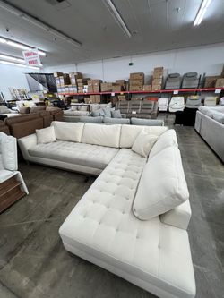 Cream fabric tufted sectional sofa with right chaise