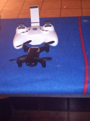 Photo The white drone is a E 61 serious Mimi drone and the other one is a prpel idk what worng with it