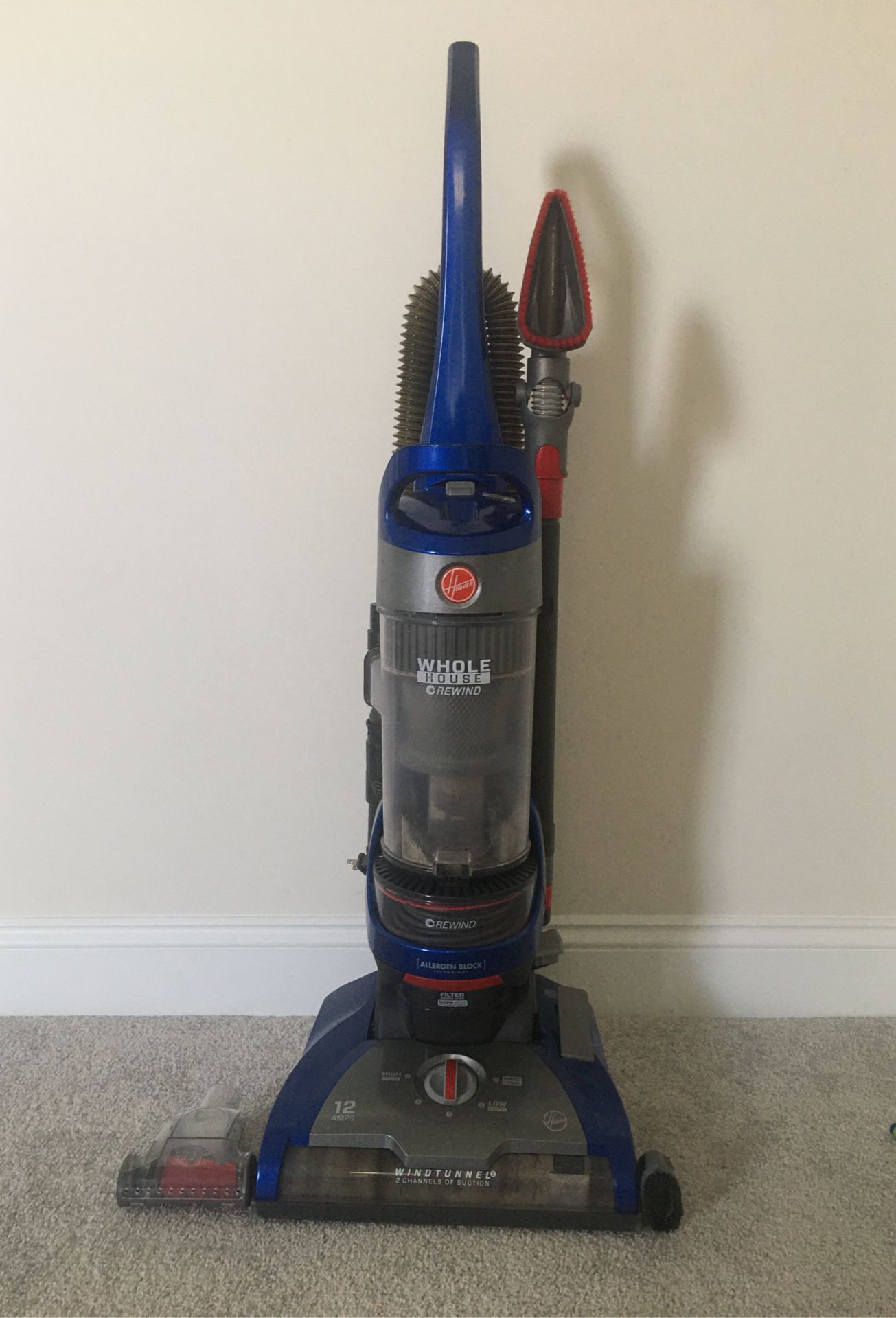 Hoover wind tunnel 2 whole house rewind bagless upright vacuum great for pets, advanced allergen block, clean from floor yo ceiling. Rarely used. 2 y