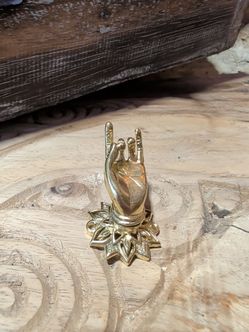 Gold Metal Hand Figurine with Lotus Base