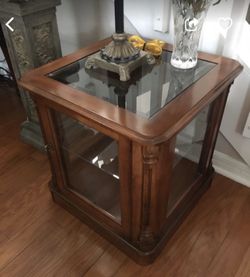Nice wood and glass end table. With light!
