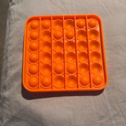 Orange Pop-It Fidget toy