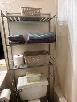 Behind toilet shelf