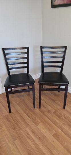 Two (2) wood foldebo schairs