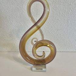 Art Glass Treble Clef Musical Note Amber, Clear And Purple Swirled On A Base