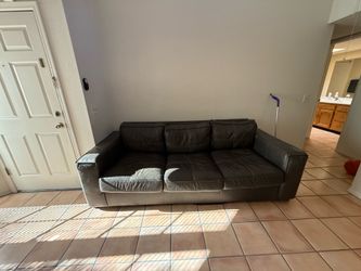 Brown leather sectional couch