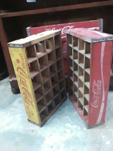 Coca-Cola bottle crates one yellow one red with 24 dividers