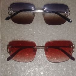 2 Pair Of Big C Cartier Glasses 