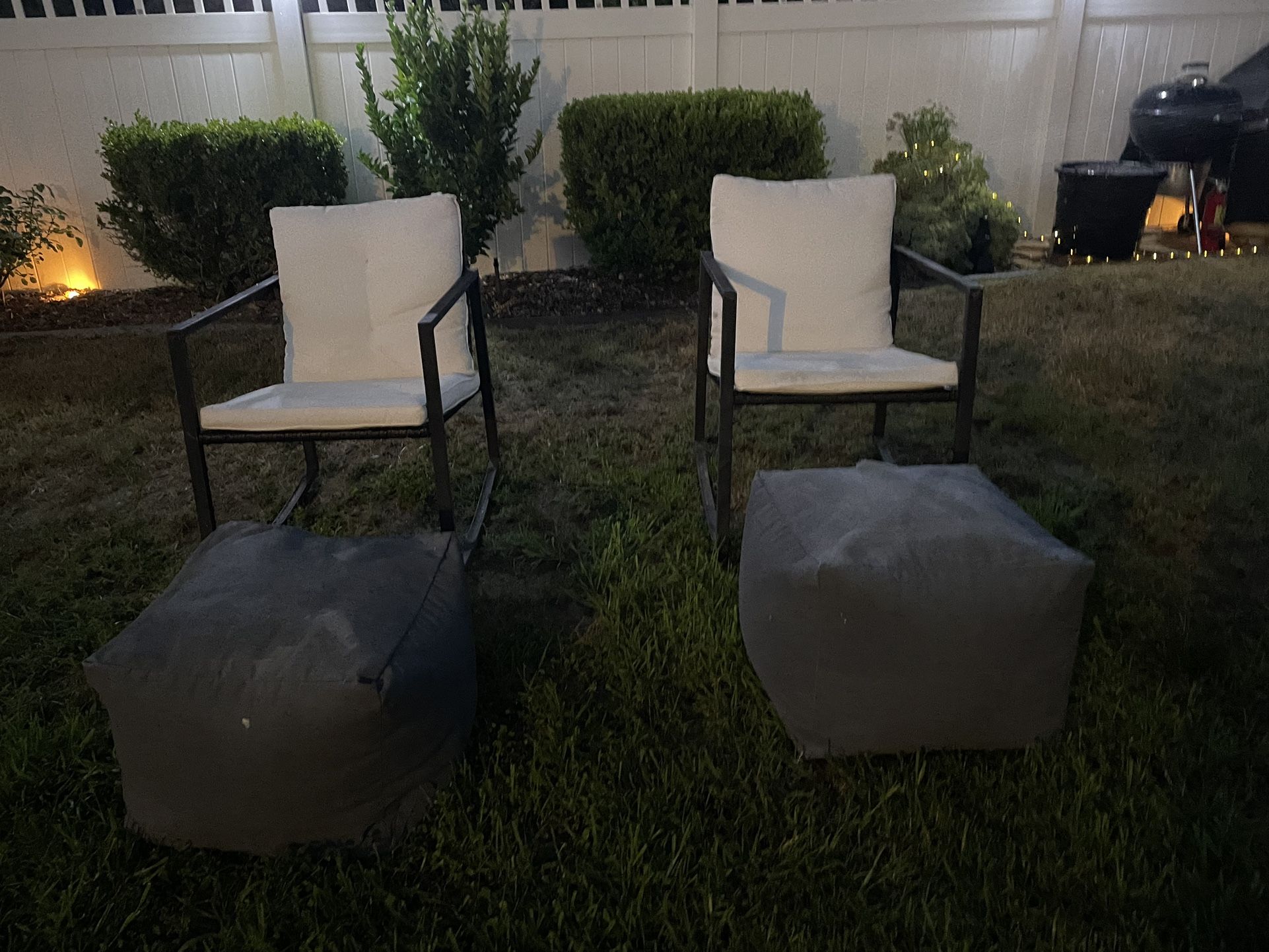 comfy outdoor seating. 2 rocking chairs and 2 Bean bag foot rests