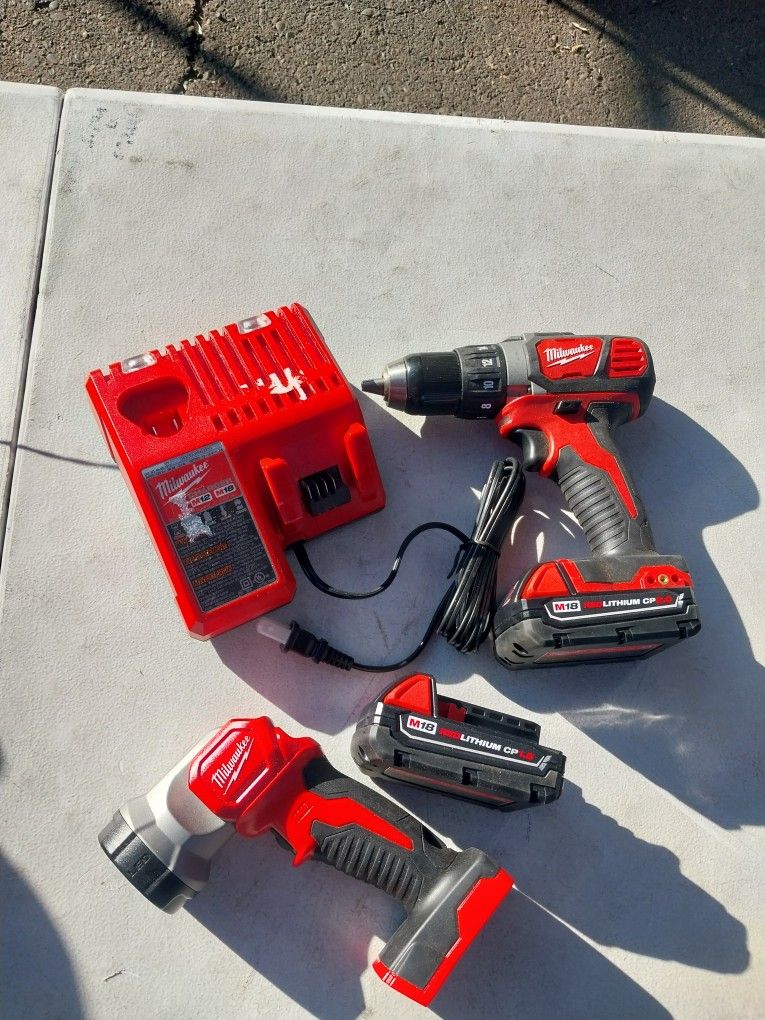 MILWAUKEE DRILL AND FLASH LIGHT 18V LITHIUM WITH BATTERYS AND CHARGER