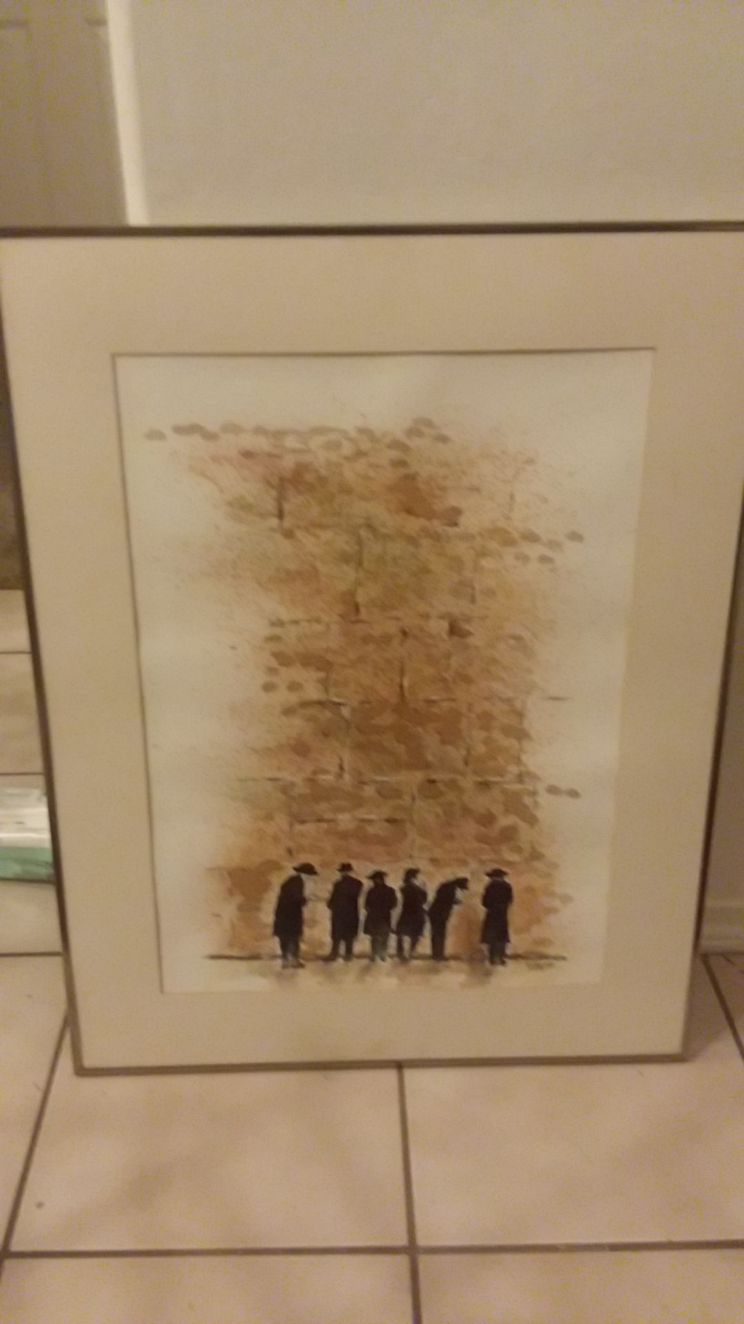5 Jewish priest looking at a famous wall