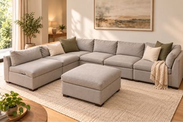 Light gray corner sectional with matching ottoman