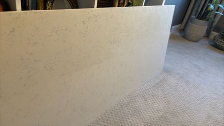 White Quartz Countertop Slab  Size: 69.5”L x 26” W x 1.25” thick.