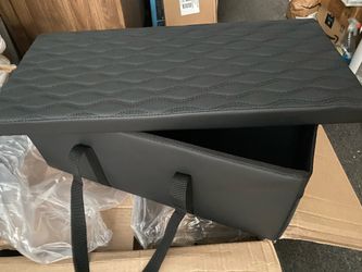 A portable storage box suitable for use in the back seat of a car, at home, or as a container for tools or picnic supplies