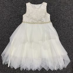 Beautiful American Princess ivory textured floral bodice and a multi-layered tulle skirt with a "hanky hem" (jagged edge) dress with rhinestone or fau