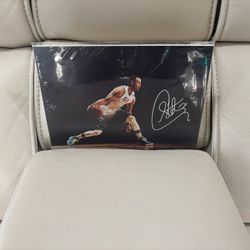 Autographed Laminated 8.5’ by 11’ Phono of Steph Curry