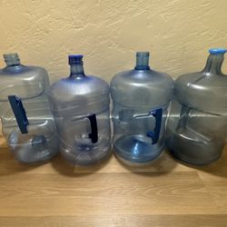 Four 5 Gallons Water Jugs