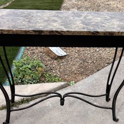 Console table with marble top .measurements 30 high, 39 long, and 15 wide 