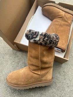 Leopard print tall Uggs.
