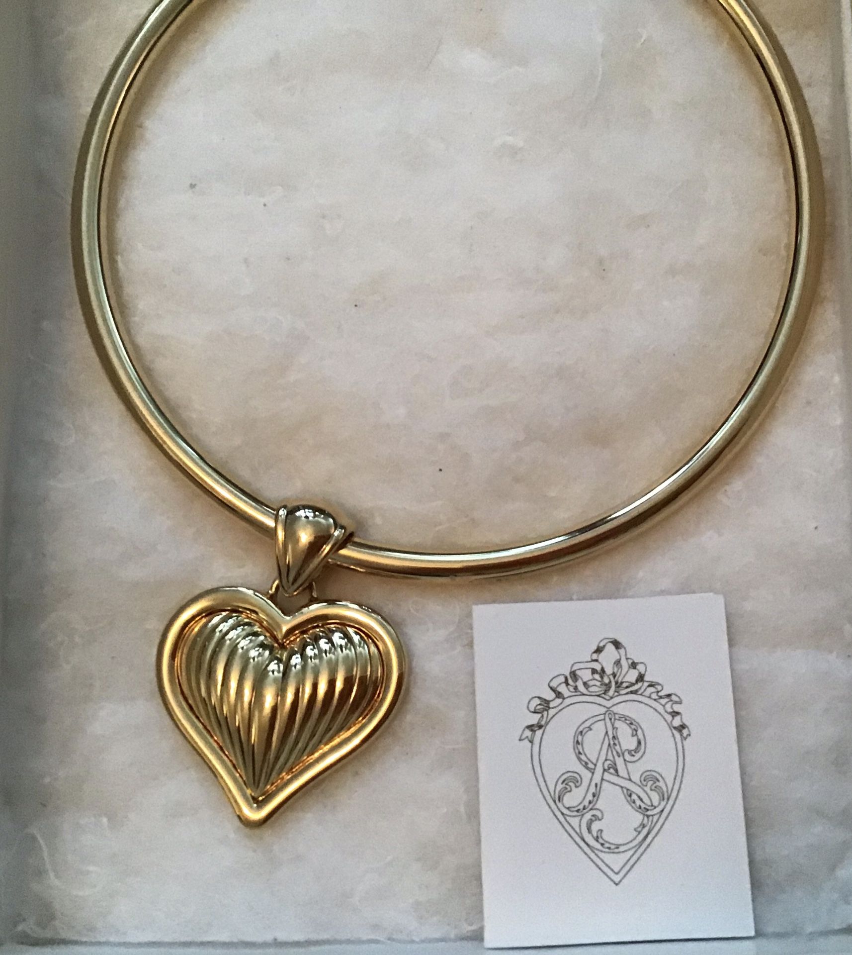 Gorgeous necklace. Double sided heart. This would make a lovely gift. Brand new. Never worn