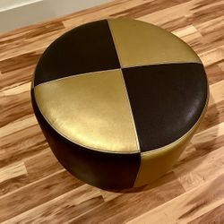 Modern Two-Tone Round Ottoman – Gold & Black Faux Leather