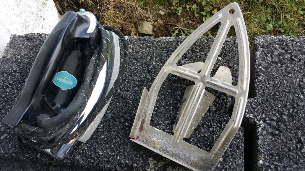 Sunbeam iron with special no-burn coating on the bottom and stand