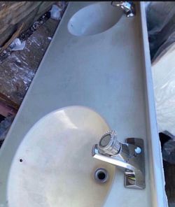 Bathroom sink and cabinets Good condition 67 long in the sink and 27in a half and long is 65 cabinet