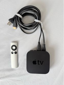 The Apple TV A1469 3rd Generation WiFi Media Streamer with Power Cord and Remote Control is a sleek and powerful digital HD media streamer. With a sin