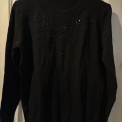 This is a Black Beautiful Sweater with Rhinestones size M