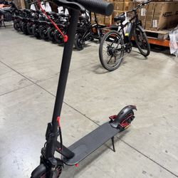 Front and rear shock-absorbing electric scooters