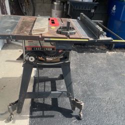 Craftsman portable job site table saw with a folding stand. 