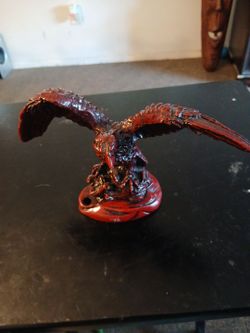+6                    This figurine is a Deep Dark Red Eagle Wings Spread statue