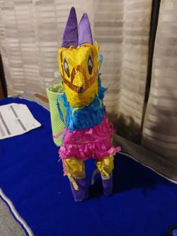 Vibrant, multi-colored mini donkey piñata