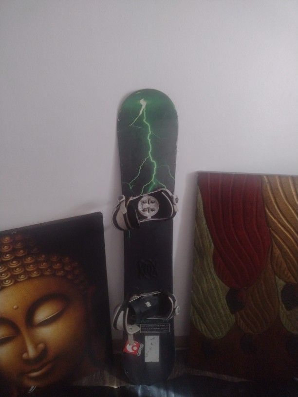 Kemper Storm Series snowboard with bindings attached.
