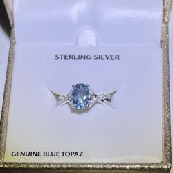 Brilliance Oval Treated Blue Topaz and CZ Twist Ring