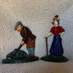 Vintage cast-iron golfer doorstops set