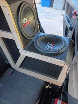 "center console over the seat speaker box with 2 twelve inch mtx's"