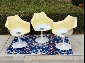 3— vintage tulip chairs.