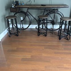 Bar, bicycle and stools