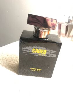 CAGED RUE21 COLOGNE SPRAY