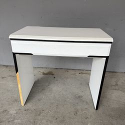White desk with black trim. Lane Company
