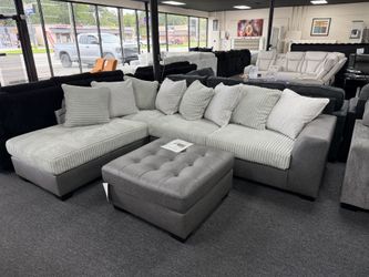 New 2 Tone Sectional $999. Oversize Ottoman $369. Delivery Available 