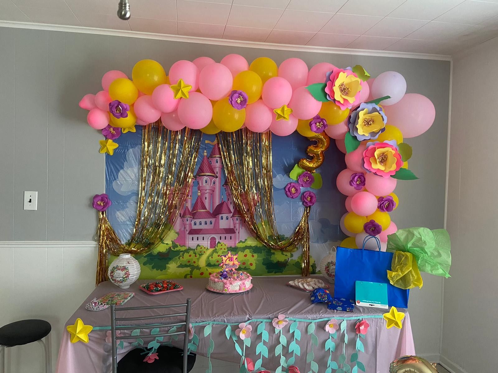 decoration with balloons and paper flowers.