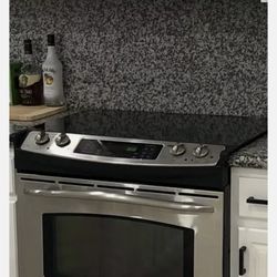 GE Profile Stainless Steel Kitchen Stove & Frigidaire Microwave Oven